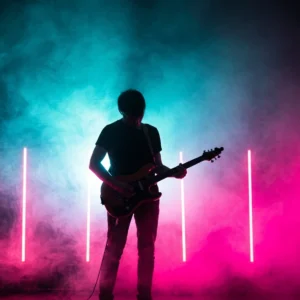 Silhouetted guitarist on a smoke-filled stage under pink and cyan neon lights, evoking 80s synth rock