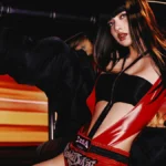 LISA in a Press Play press photo, seated in a Bangkok tuk-tuk